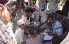 Handing labor wages in Alajool- Lahej